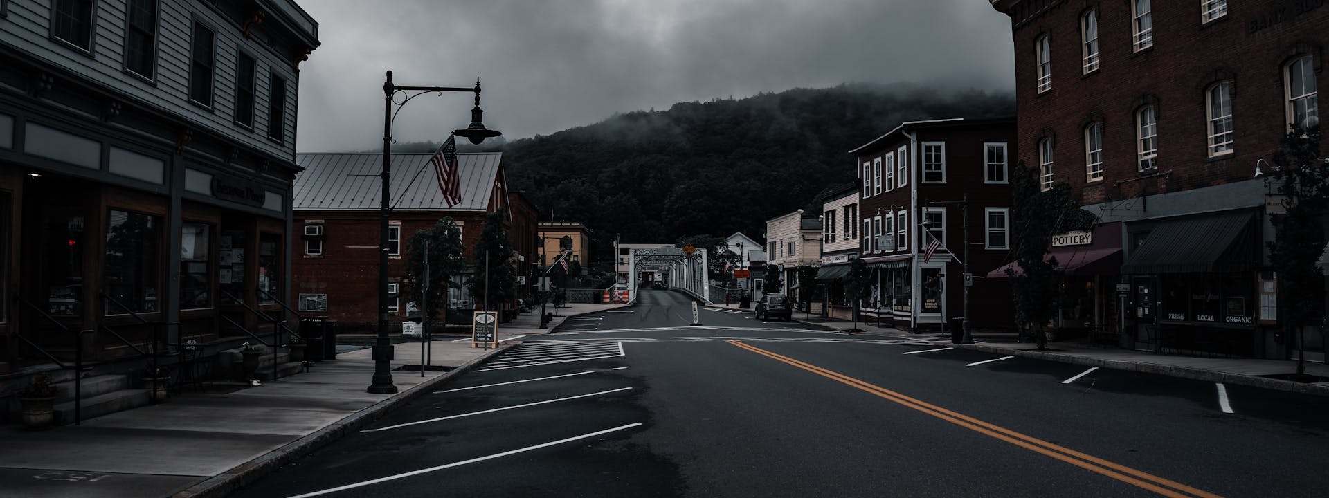 Empty western main street with moody clouds